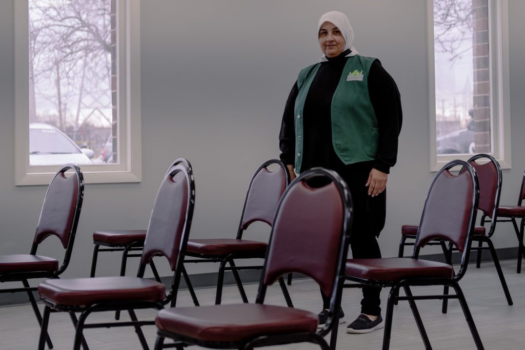 Samira Juwayyid poses in the waiting room at the Mosque Foundation's food pantry in Bridgeview. 