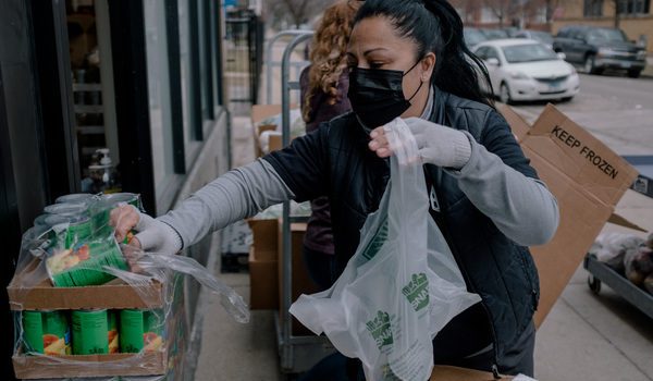 SANAD Food Pantry Volunteer bagging food