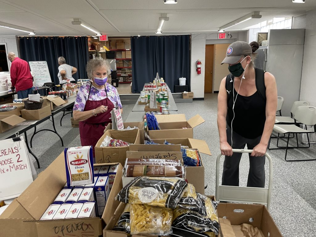 Julie Stokes (right) picks out groceries at Broadview Services Center