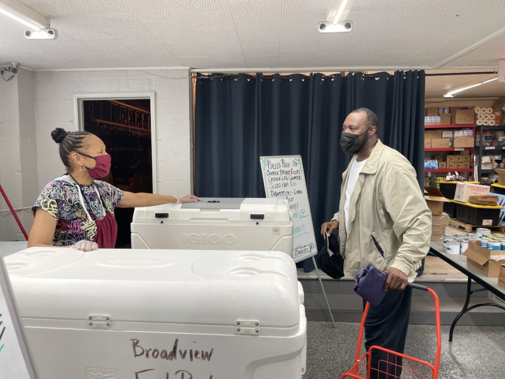 Darryl Thomas picks up food from Broadview Service Center