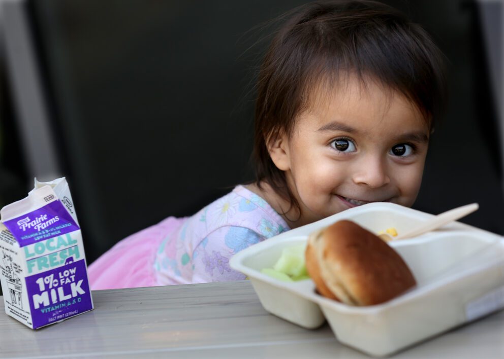 Olivia Salazar eats her Lunch Bus meal in Lansing