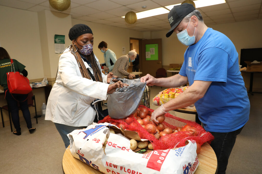 Patricia Murray participates in the Pines of Edgewater food distribution.