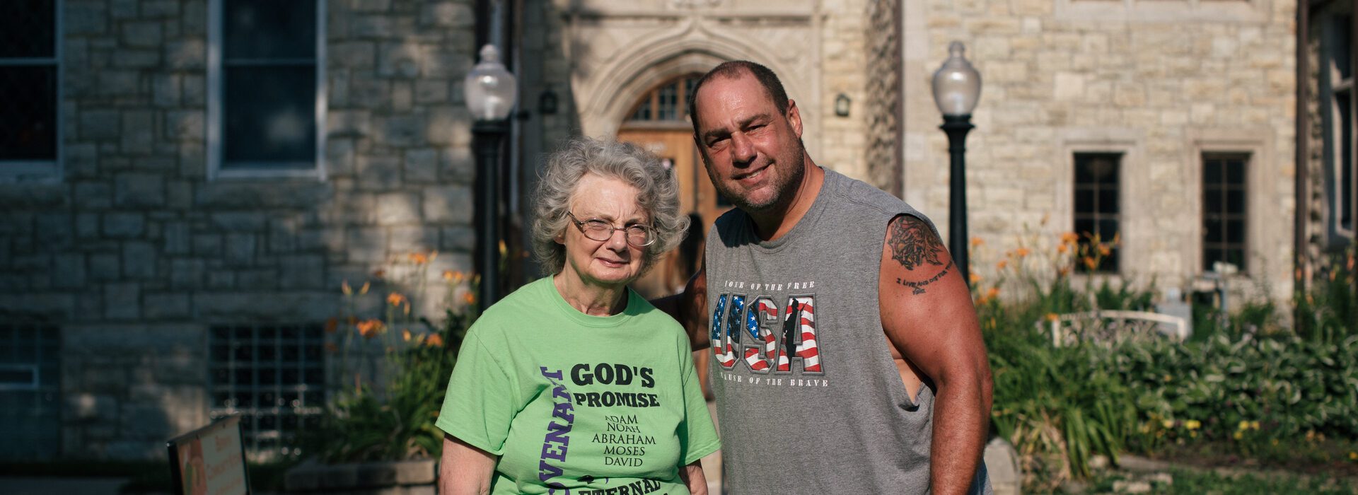 Man and woman standing outside with food