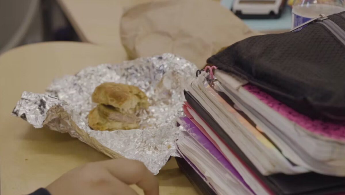 Child at school with food and backpack