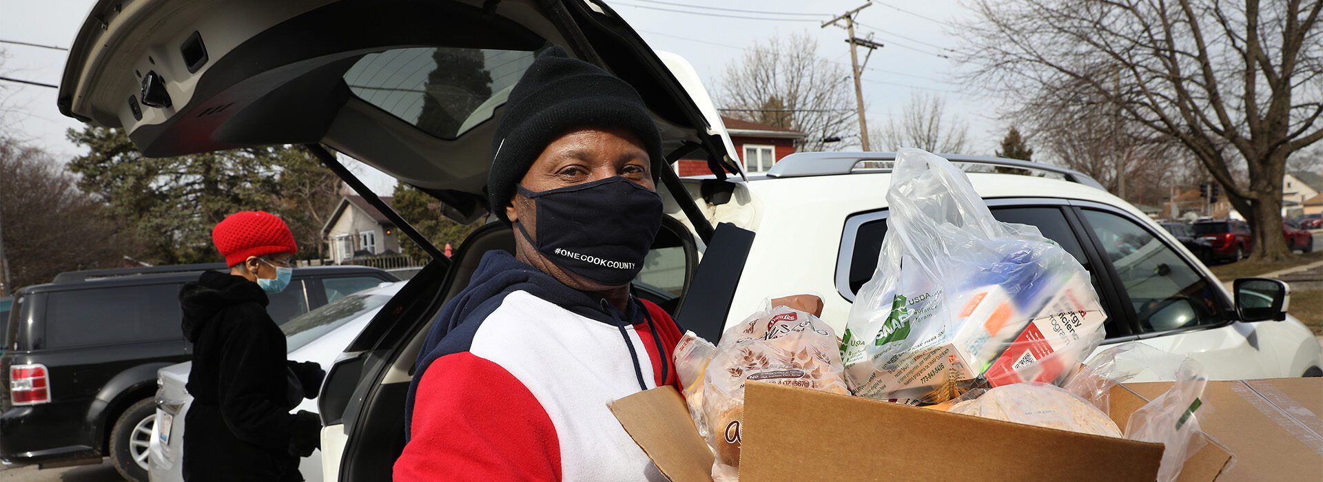 Man holding box of food