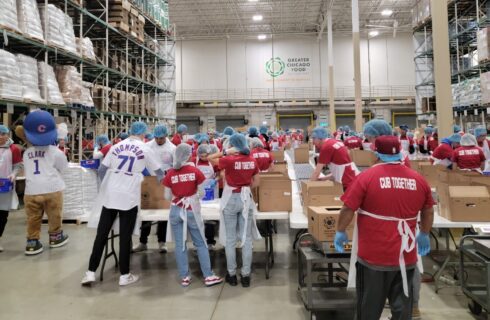 a group of young athletes volunteers at a repack event