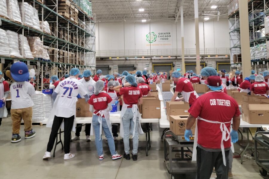 a group of young athletes volunteers at a repack event