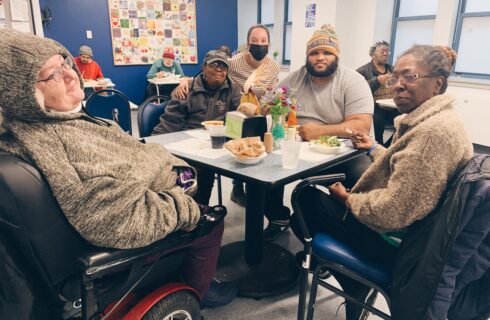 food pantry guests smile at the camera