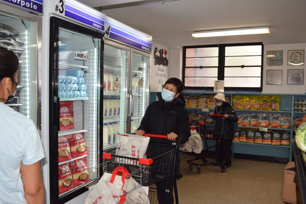 a woman shops in a food pantry