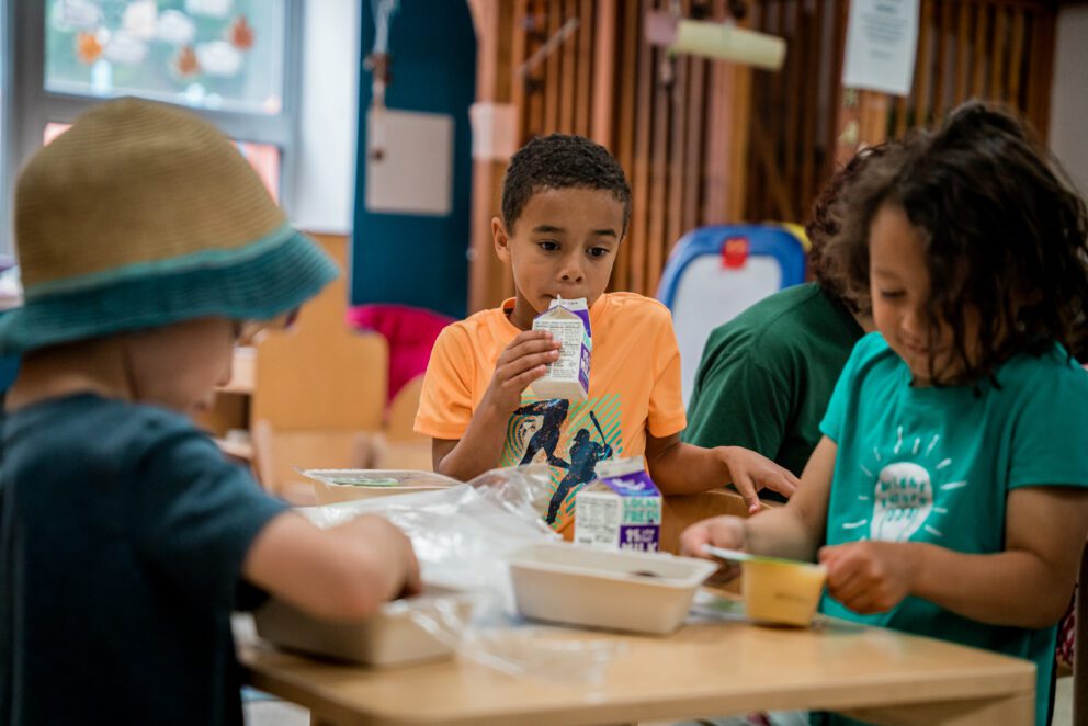 summer camp kids eat breakfast