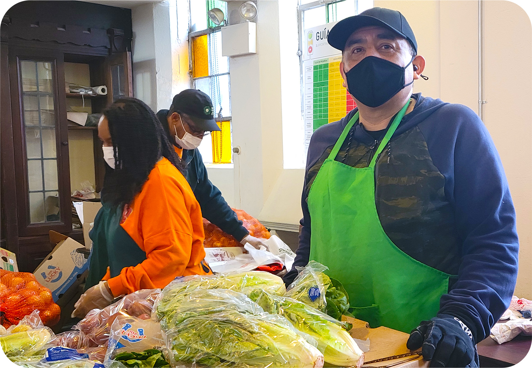 A gentleman helping sort vegetables at the First Presbyterian Kimbark's Free Food Market.