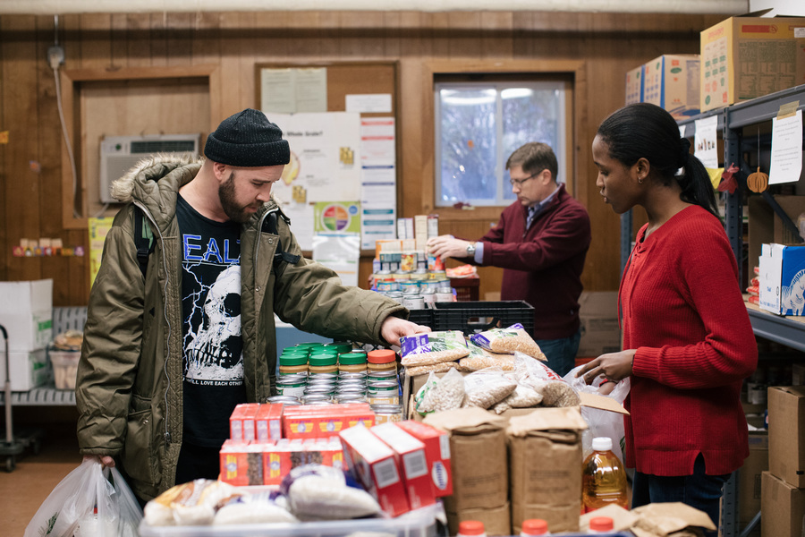 A community member picking out food at a pantry in our network