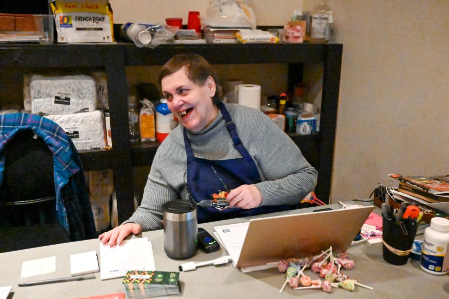 Maggie Jordan sits at the front desk.