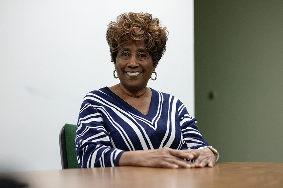 a woman smiles at the camera