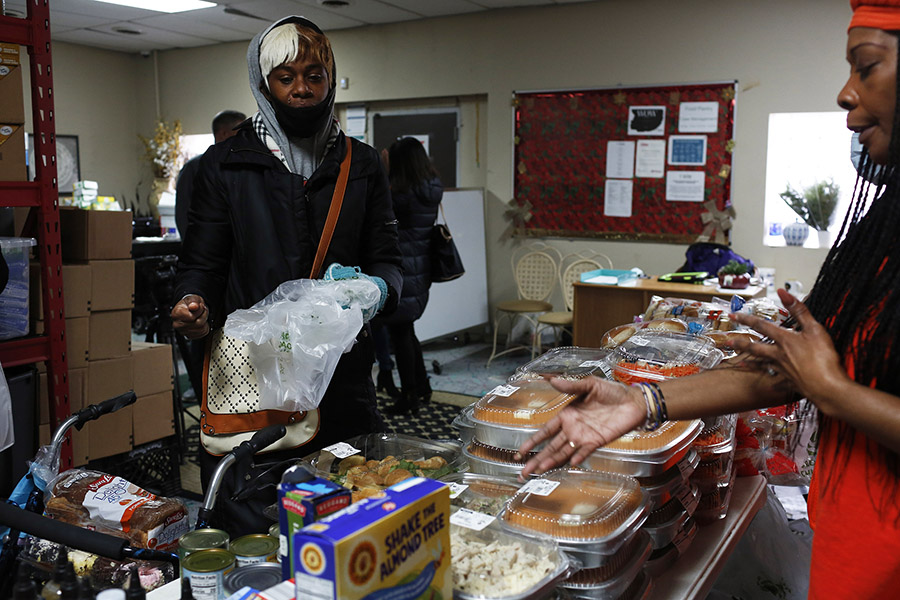 a woman shops at a food pantry