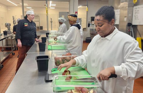 students learn knife skills