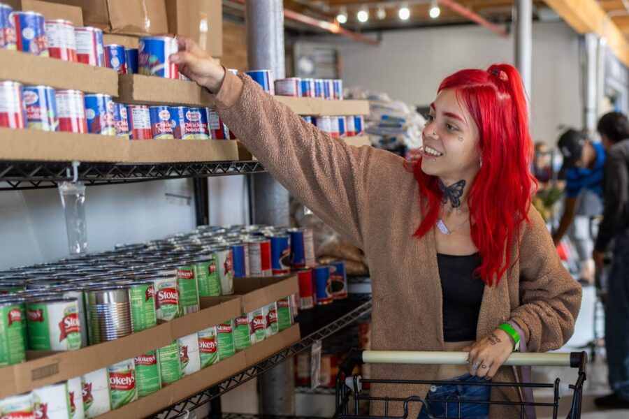 Women shopping for canned goods