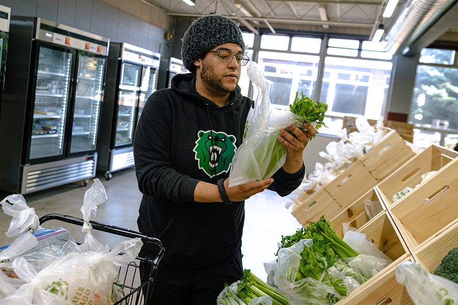 a man shops for produce at a food pantry