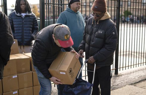 a man puts a food box in a guest's cart