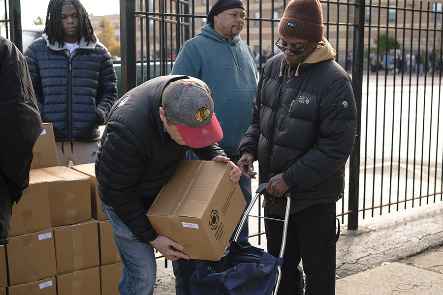 a man puts a food box in a guest's cart