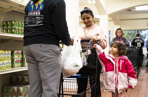 A family shops for groceries