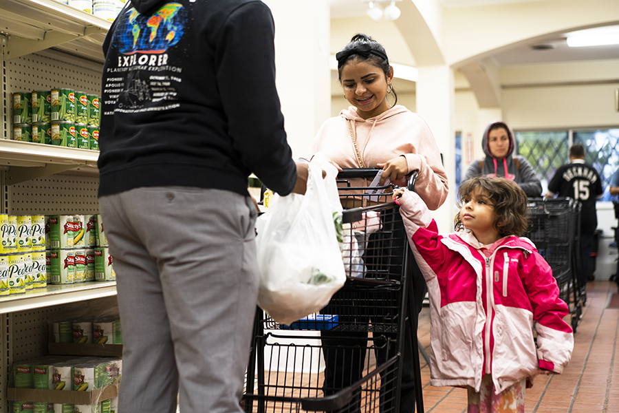 A family shops for groceries